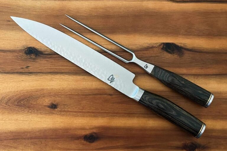 Professional carving knife placed beside a roasted turkey on a wooden board.