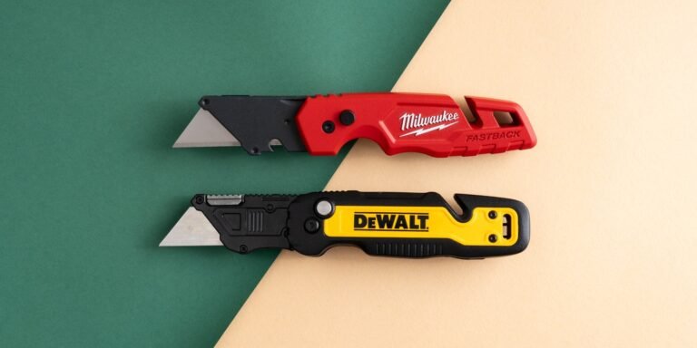 A professional utility knife sits on a wooden workbench for the best utility knife review.
