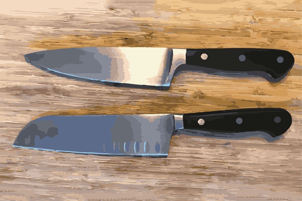 Three different kitchen knives arranged on a marble surface next to chopped vegetables.