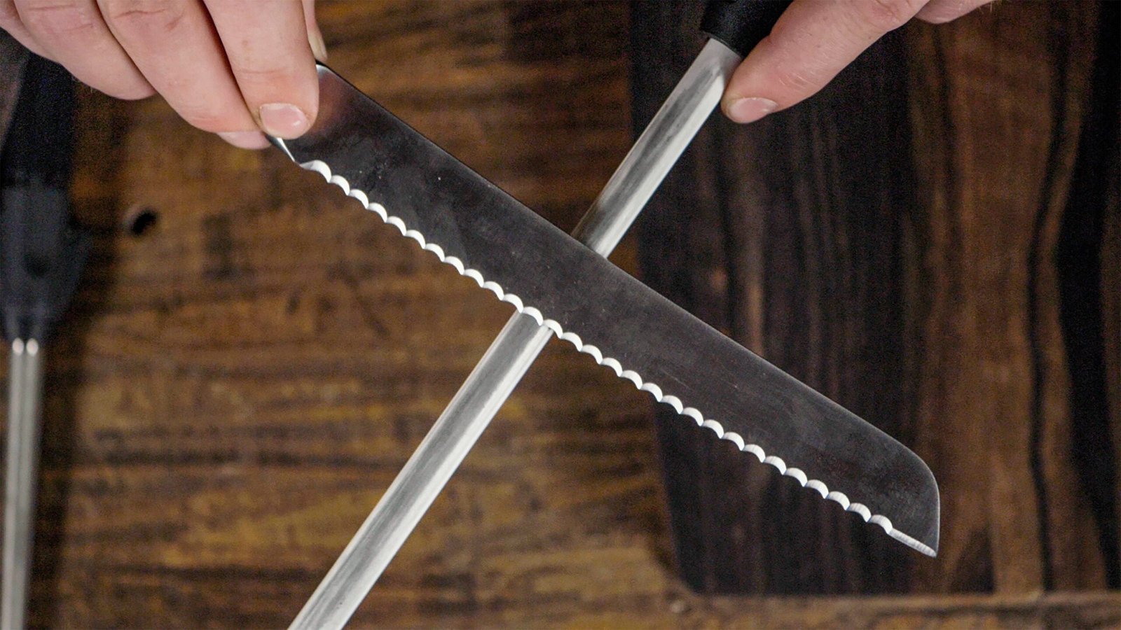 Manual knife sharpeners and a honing rod sitting on a kitchen counter.