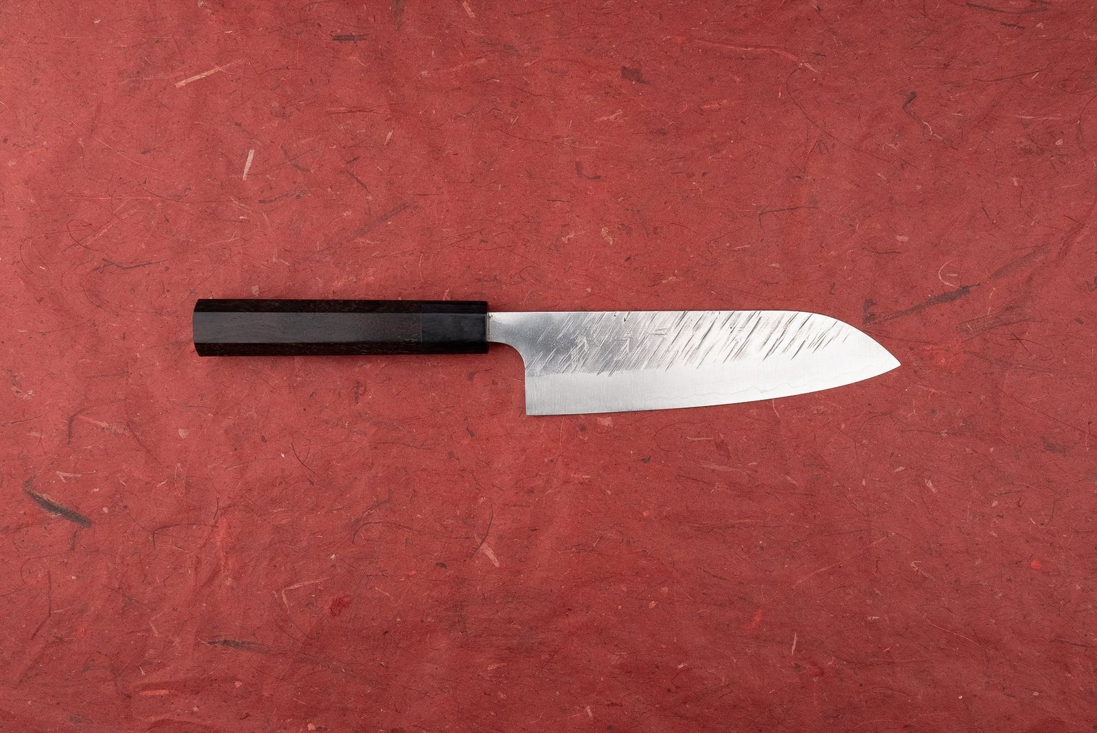 A tidy kitchen drawer with a knife storage insert to protect blades.